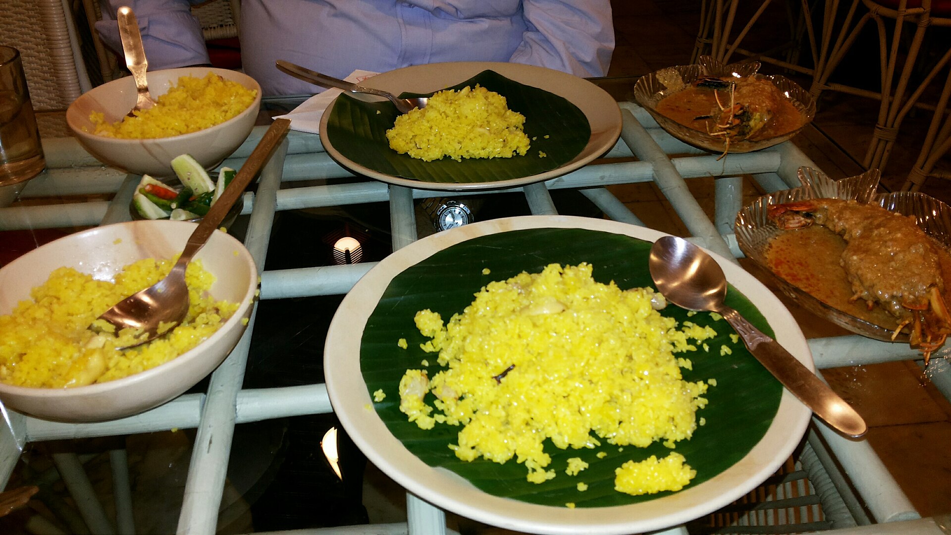 Basanti pulao served with prawn malai curry, a Bengali festive pairing