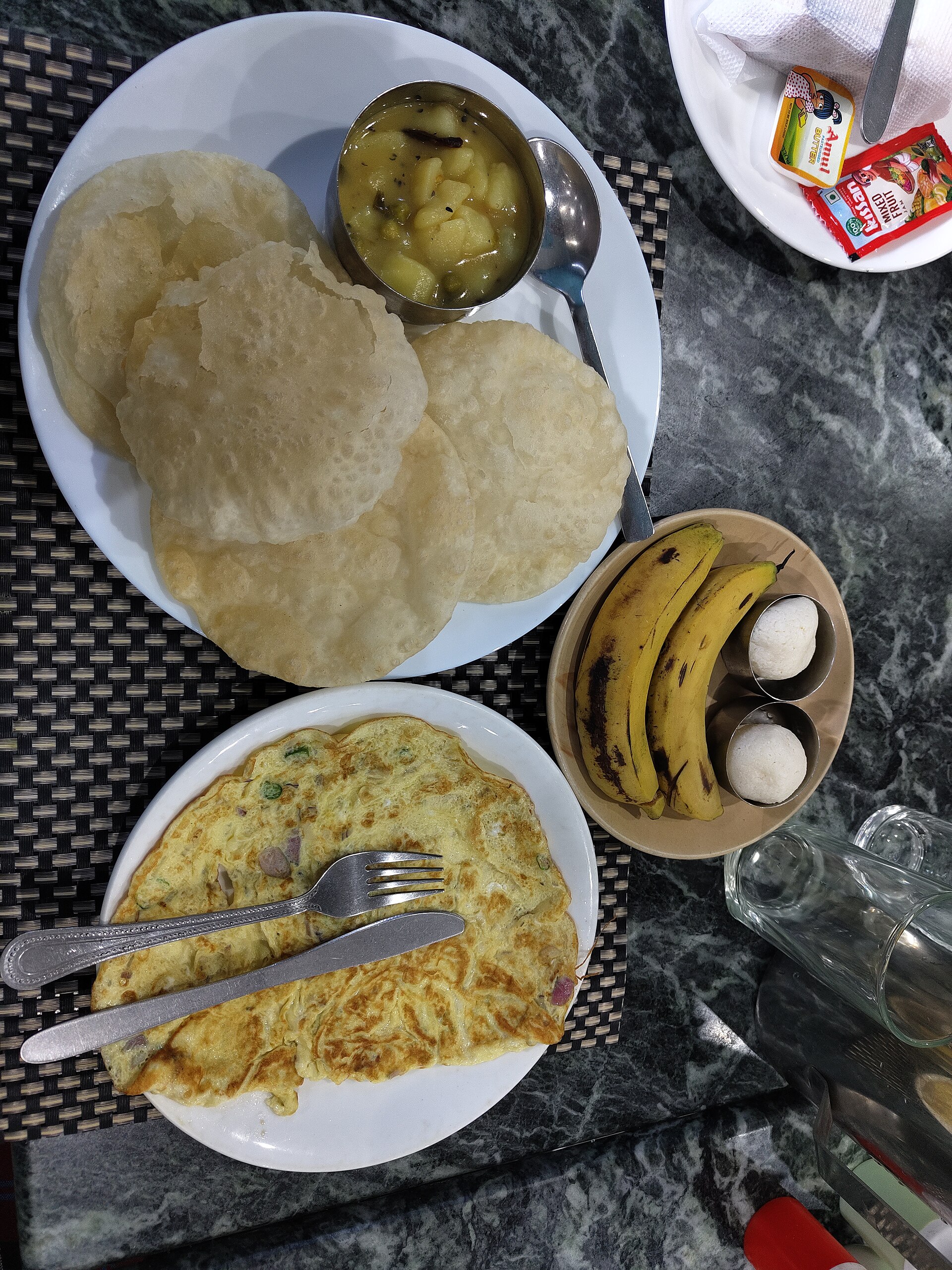 Bengali thali with rice, vegetable curries and fried sides